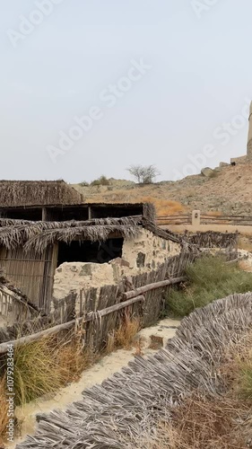 The Hatta Watchtower stands prominently atop the mountain ridge, overlooking the inland enclave of Hatta Heritage Village in Dubai.