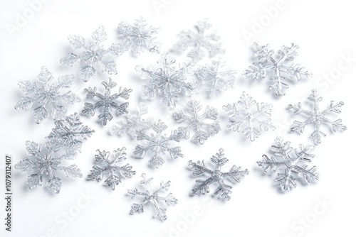 Elegant arrangement of multiple transparent snowflakes on a white background