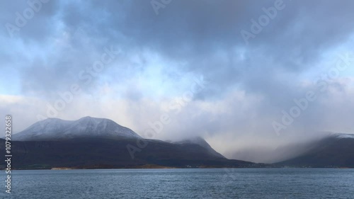Wallpaper Mural Autumn landscape of the Lyngen Alps in Northern Norway with snowy peaks, dramatic clouds, and a tranquil fjord. Torontodigital.ca