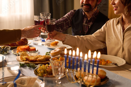 Photography Unrecognizable friends clinking glasses with red wine, smiling widely and enjoyi