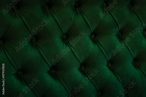 Closeup back of a sofa. Green upholstery fabric