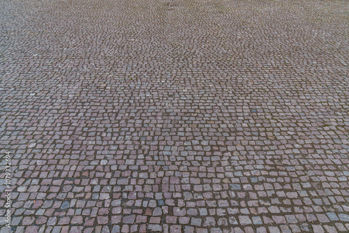 Small paving stones laid on a large square