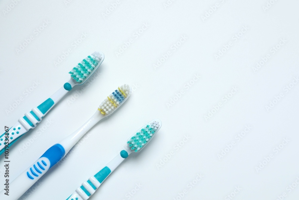 Various toothbrushes on a white background. Concept of tooth treatment and dental care Various toothbrushes on a white background. Concept of tooth treatment and dental care