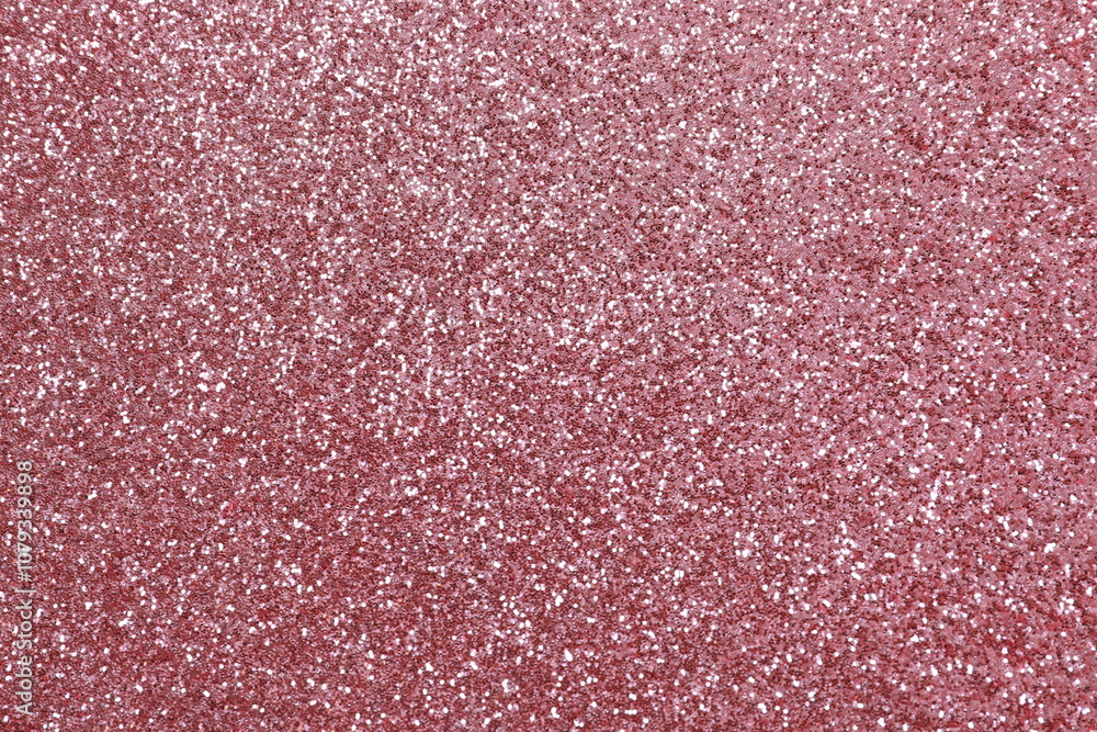 Fototapeta premium Pink glitter texture sparkling shiny wrapping paper background for Christmas holidays seasonal wallpaper decoration, greeting and wedding invitation design element