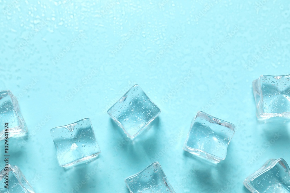 Top view photo of scattered melting ice cubes on light blue background Top view photo of scattered melting ice cubes on light blue background