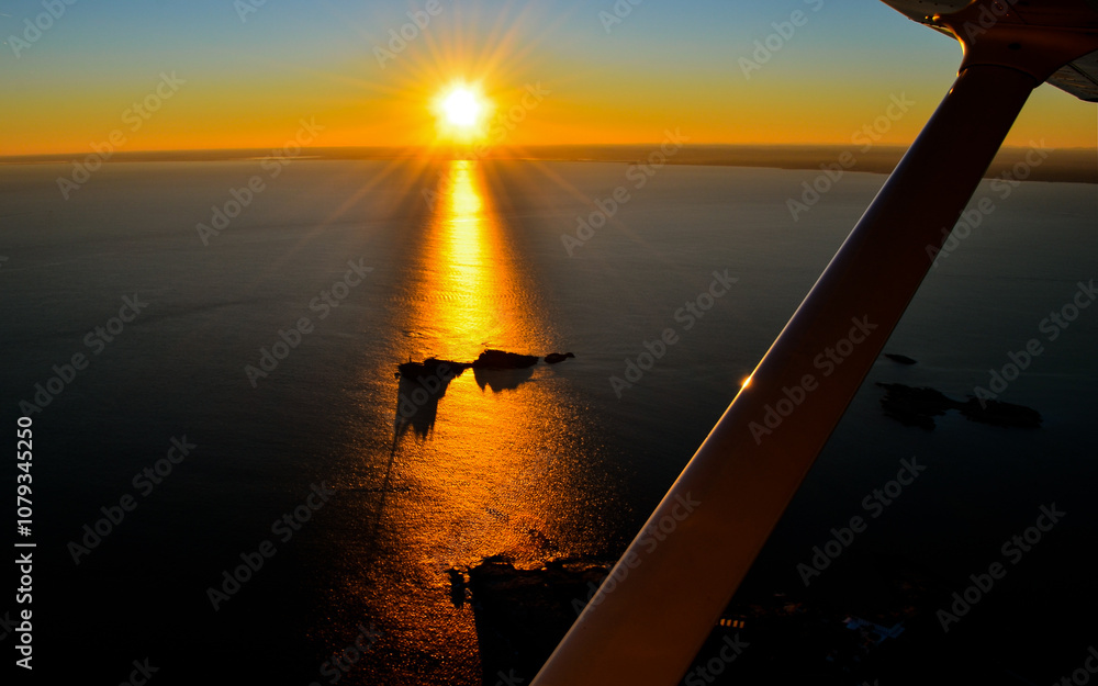 Fototapeta premium Sunset from plane