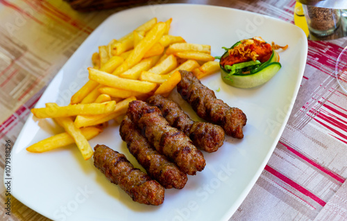 Cevapcici with french fries. Balkan cuisine