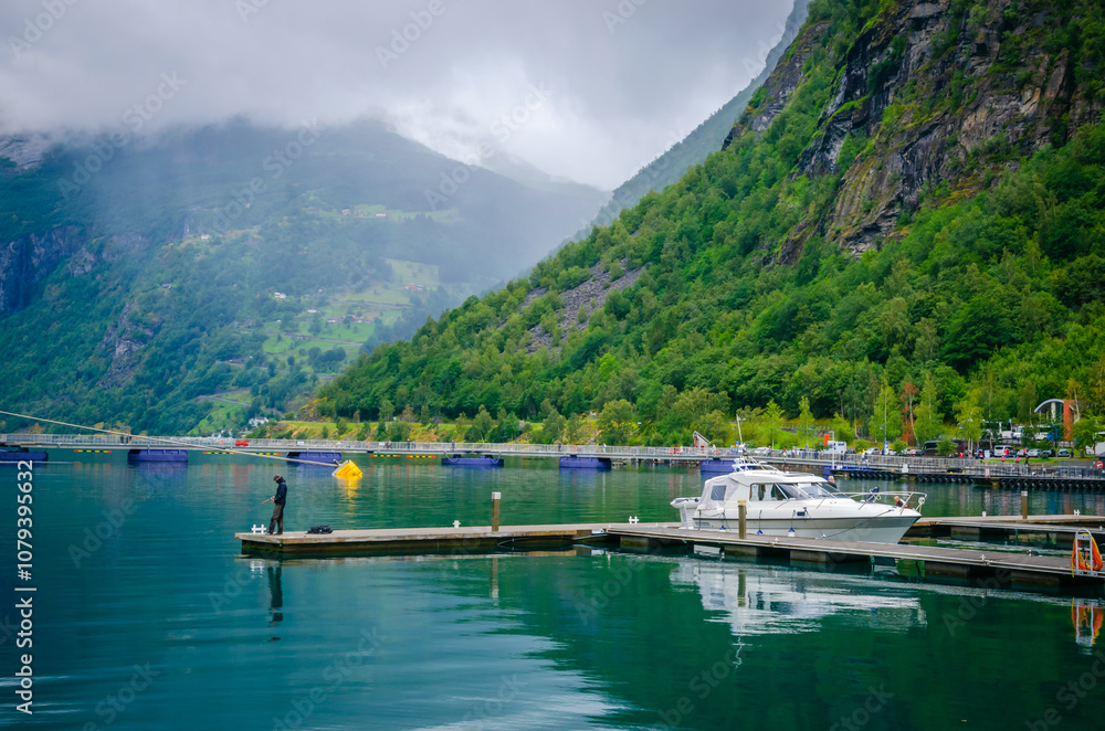 View on the coast and port of Geirangerfjord in town Geiranger, one of the most beautiful fjords in Norway
