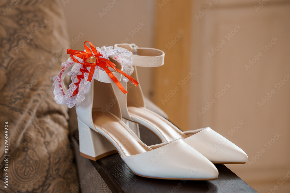 Elegant White Wedding Shoes with Decorative Garter and Ribbon Accents Elegant White Wedding Shoes with Decorative Garter and Ribbon Accents