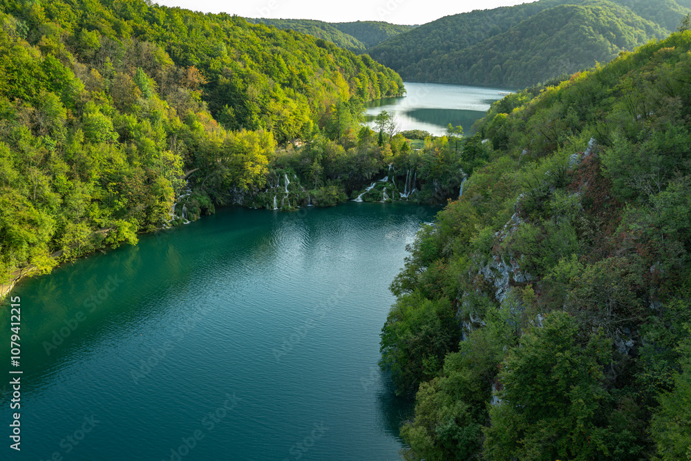 Fototapeta premium Plitvice Lakes National Park. Croatia. Big waterfalls. Nature travel background. Beautiful summer nature. Plitvice waterfalls in Croatia. Lake in deep forest. Turquoise Lakes.