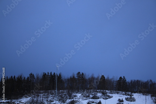 Winter landscapes in Norway showcase serene snowy mountains, icy fjords, and peaceful coastal views. Capturing the beauty of snow-covered trees, quiet roads, and glowing sunsets creates a sense of cal