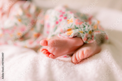 Obraz na plátne A baby girl is sleeping showing off her baby feet and toes.