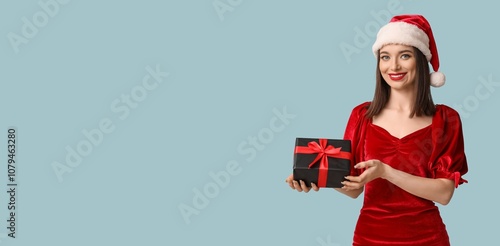 Pretty young woman in Santa...