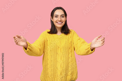 Young woman opening arms fo...