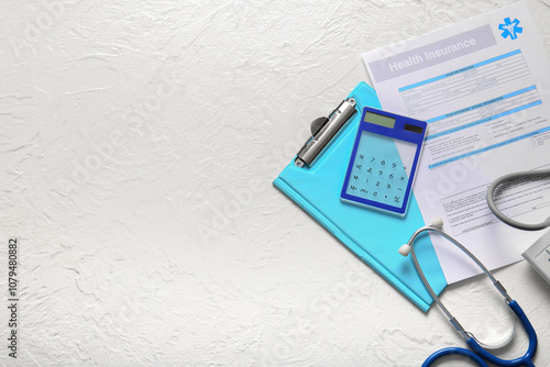 Stethoscope, calculator and clipboard on white background. Health insurance c...