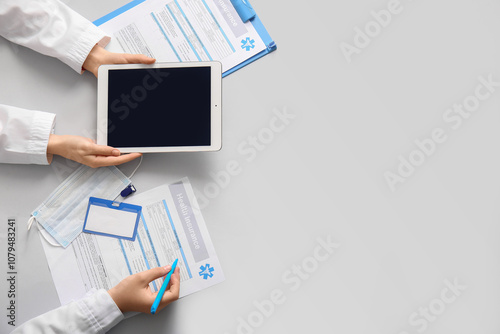 Doctor's hands with tablet ...