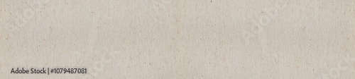 Beige handmade paper texture with natural fibers, ideal for eco-themed backgrounds and design.