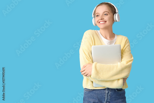 Young woman in headphones w...