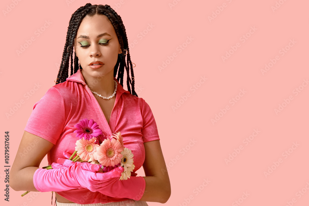 Stylish African-American woman with braids and flowers on pink background Stylish African-American woman with braids and flowers on pink background