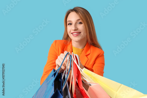 Happy young woman holding m...