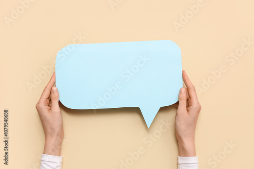 Female hands with blank pap...