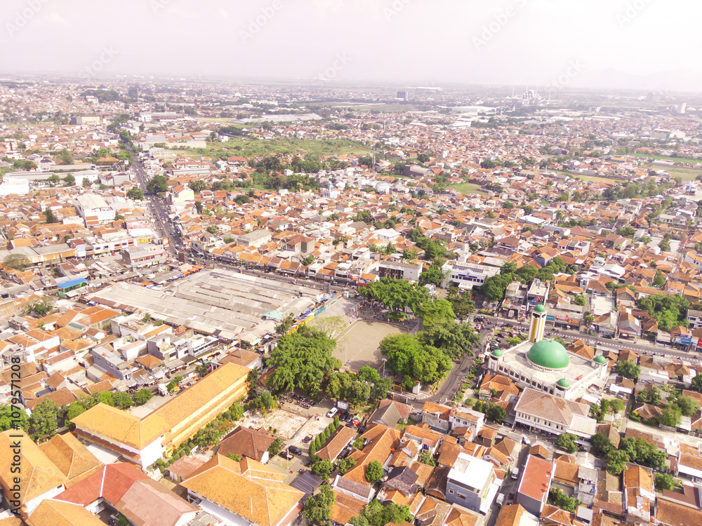 Obraz premium Bird eye view Landscape of downtown Ujung berung, Indonesia. The city center contains the grand mosque, the town square, and the busy city streets. Aerial Perspective Photography 