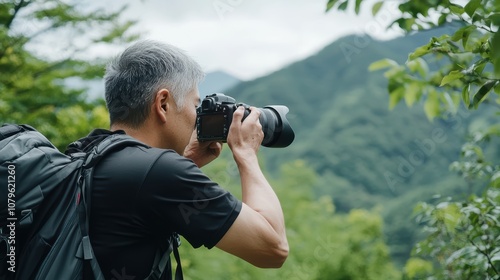 Japanese man photographing captivating nature in remote location landscape outdoor scenic perspective for nature lovers