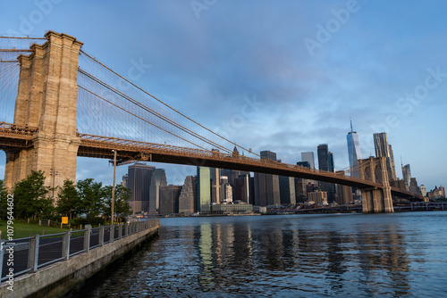 Brooklyn bridge to Manhattan. Urban architecture of New York city. Brooklyn bridge of New York city. Brooklyn landmark. Manhattan cityscape with skyscraper architecture. Hudsson river