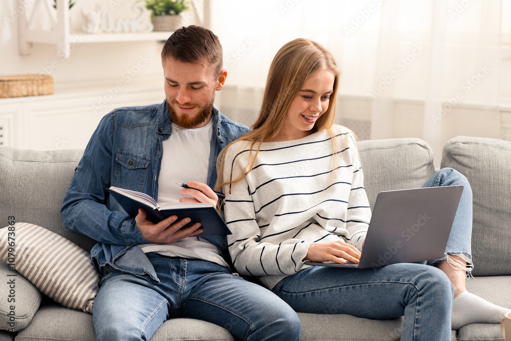 Millennial couple studying and working online at home, free space Millennial couple studying and working online at home, free space