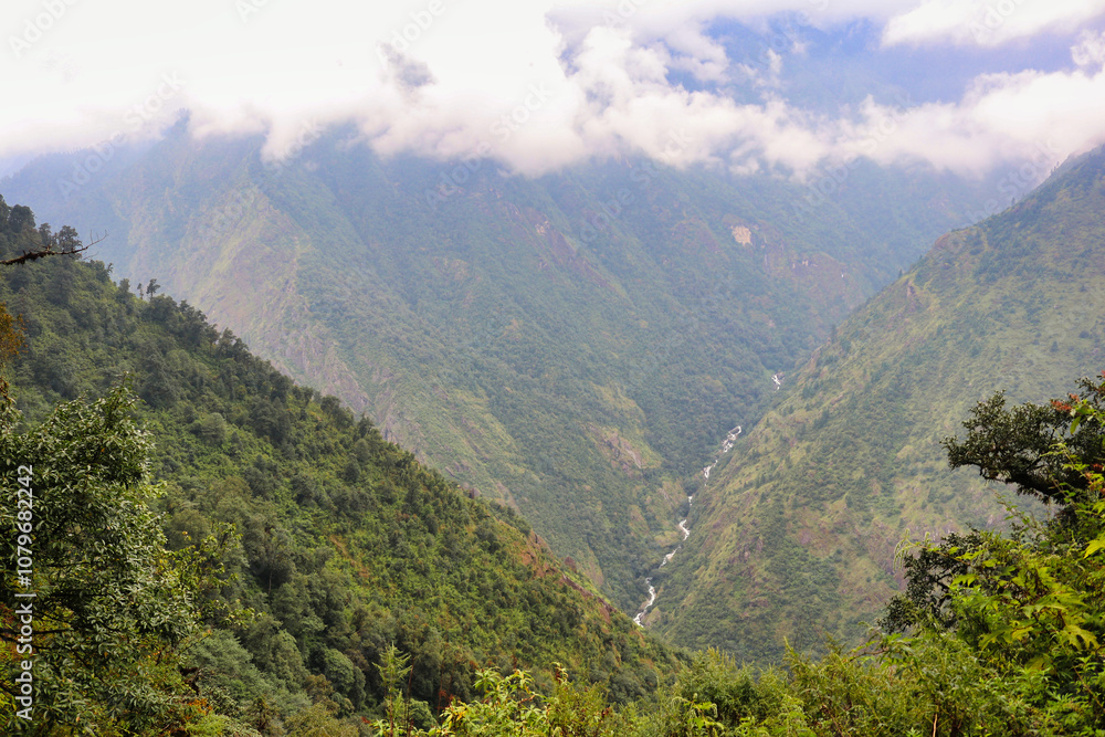 Naklejka premium Mountain streams running through the deep valleys of lowland Khumbu region near Paiya village on route to Base camp of Mera Peak,a 6476 meter high peak in the Khumbu Himalayas,Nepal