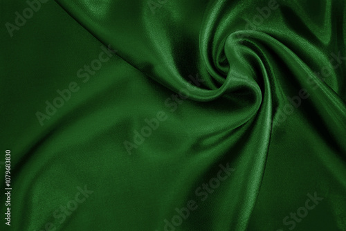 Dark green fabric cloth texture for background and design art work, beautiful crumpled pattern of silk or linen.