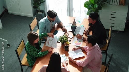 Wallpaper Mural Top view of project manager present financial graph to investors at meeting. Professional marketing team brainstorming financial idea while looking at financial statistic from laptop. Convocation. Torontodigital.ca