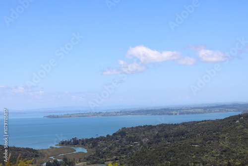 Wallpaper Mural blue ocean bays and green forested lands under blue sky and fluffy white clouds Torontodigital.ca