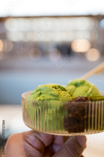 A bowl of green tea or matcha ice cream with sweet red bean photo