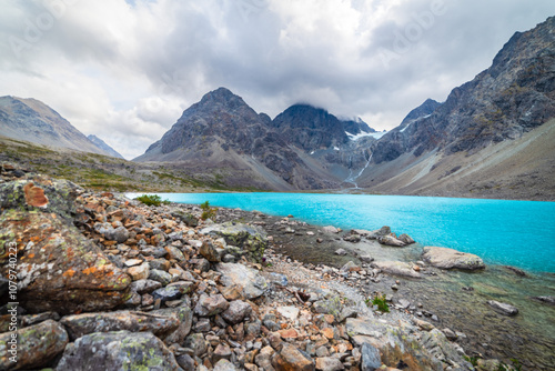 Turquoise Water Below Glacier photo