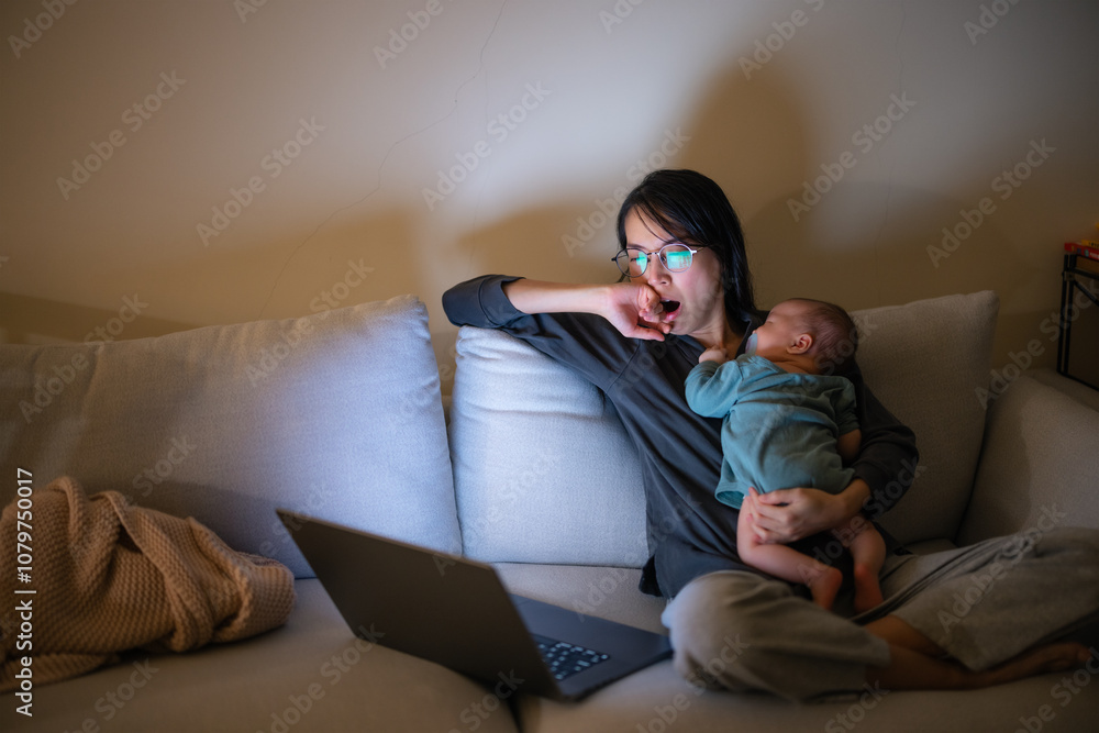 Working Mother Holding Baby at Night