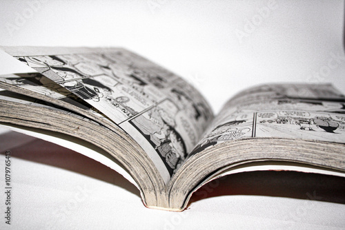 An open Detective Conan comic book on white background