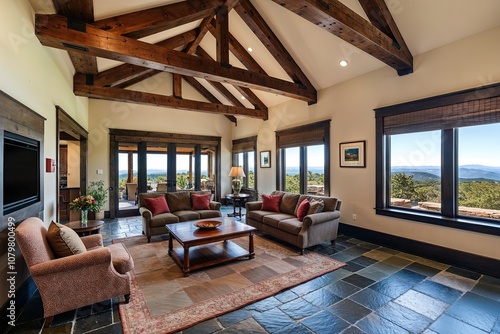 Expansive Lounge with Slate Flooring Exposed Wood Beams and Stunning Panoramic Views