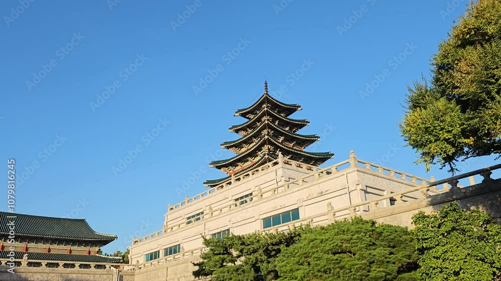 A View Of Pagoda At Gyeongbokgung Palace In The National Folk Museum Of Korea, Seoul, South Korea. Low Angle Sideways A View Of Pagoda At Gyeongbokgung Palace In The National Folk Museum Of Korea, Seoul, South Korea. Low Angle Sideways