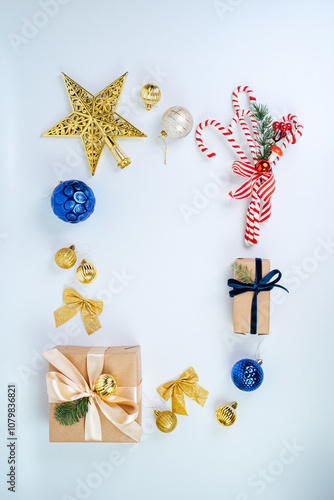 Christmas frame with gift boxes, paper's rools and decorations. Happy New Year. Flat layout, top view, a place to copy. photo