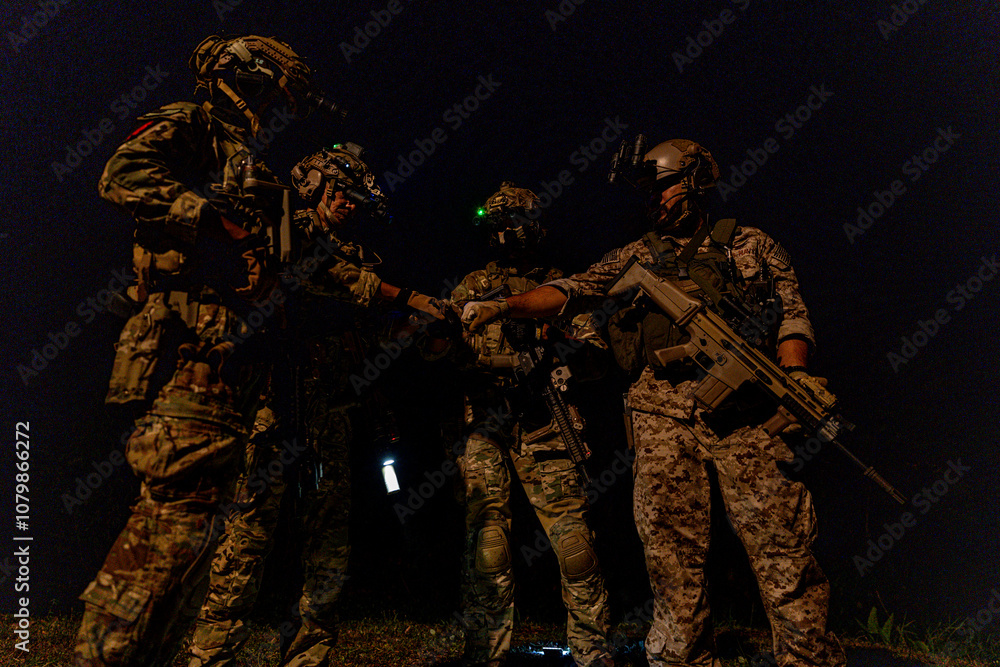 A group of military men in combat gear patrol in the middle of a desert and tropical jungle. Soldiers in full combat gear in dry weather conditions assemble and march on a mission. A group of military men in combat gear patrol in the middle of a desert and tropical jungle. Soldiers in full combat gear in dry weather conditions assemble and march on a mission.