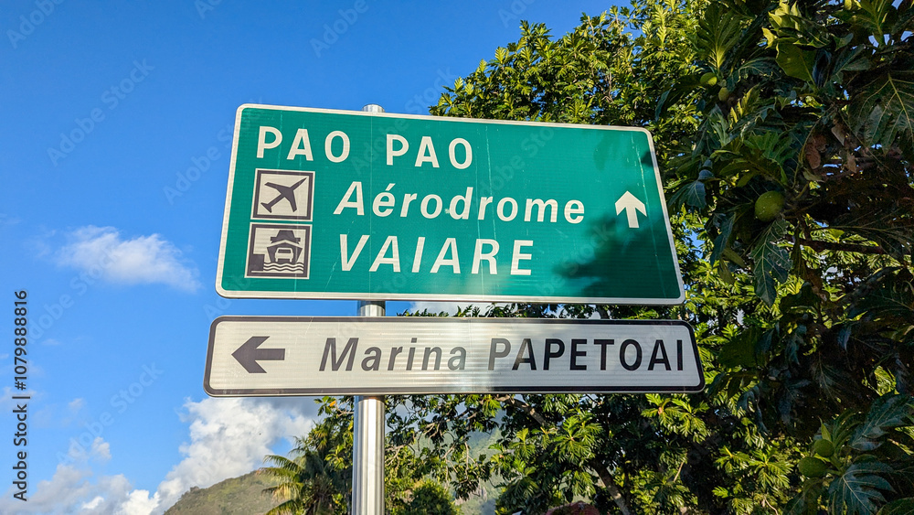 Fototapeta premium Close up of street sign for airport, ferry port harbour, and marina on tropical island of Moorea, French Polynesia in South Pacific