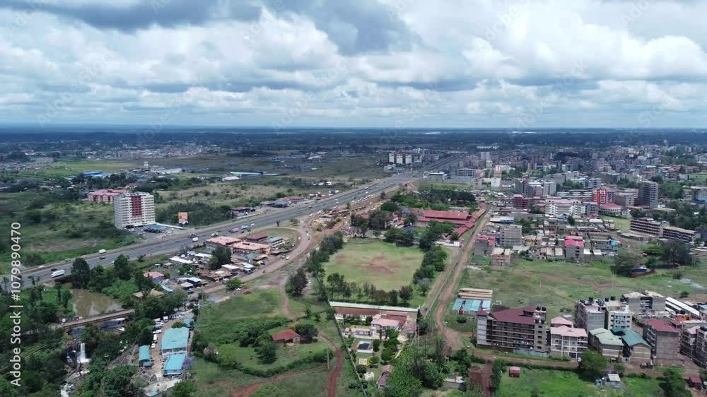 Nairobi suburb ruiru with thika road highway, scattered buildings, and green spaces, aerial view Nairobi suburb ruiru with thika road highway, scattered buildings, and green spaces, aerial view