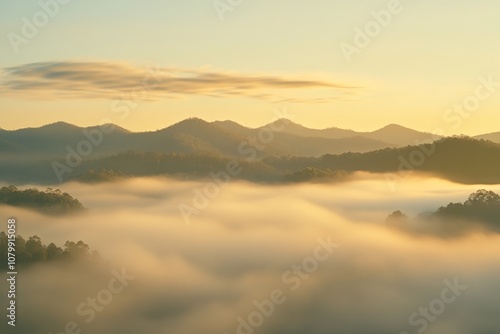 Serene Mountain Landscape at Sunrise with Misty Valleys Background