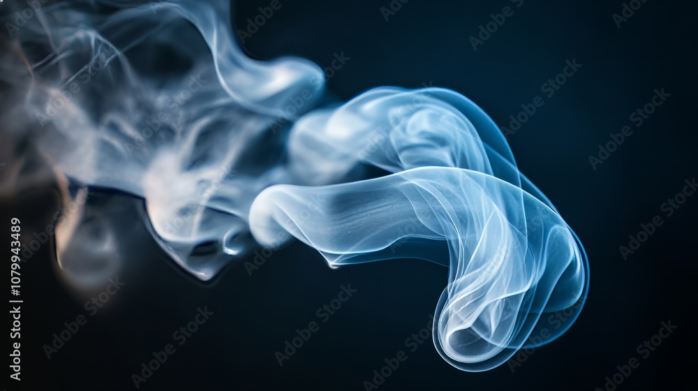 Fototapeta premium A delicate white smoke swirl capturing light, isolated on a black background,