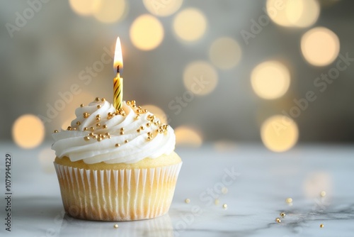 Festive Cupcake with Candle and Bokeh Background photo