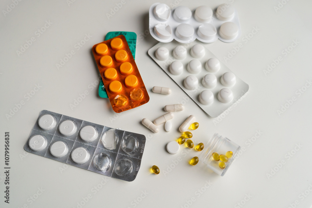 Pill packagings with pills and capsules on white background Pill packagings with pills and capsules on white background