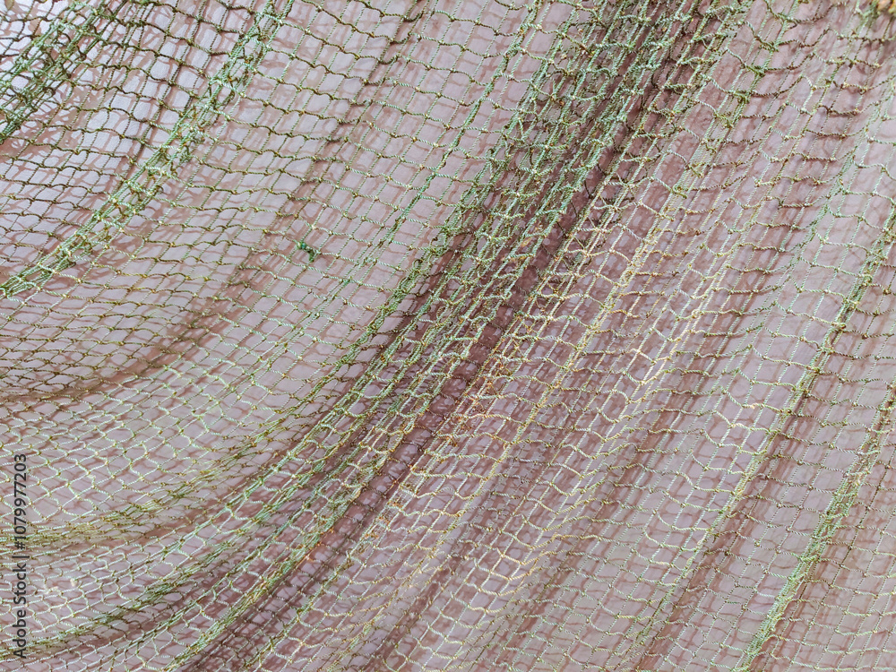 Fototapeta premium The fishing net is like a background on the wall. 