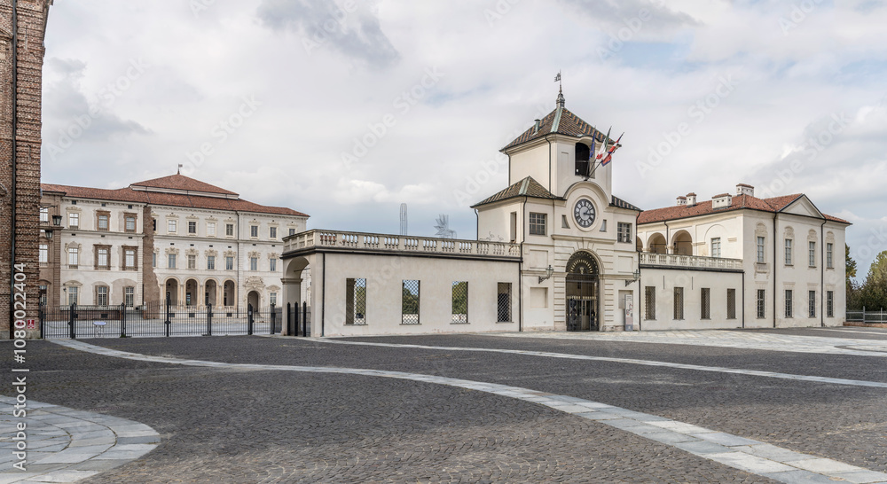 Fototapeta premium Clock tower entrance at Savoia Royal palace Court of Honor, Venaria Reale, Torino, Italy