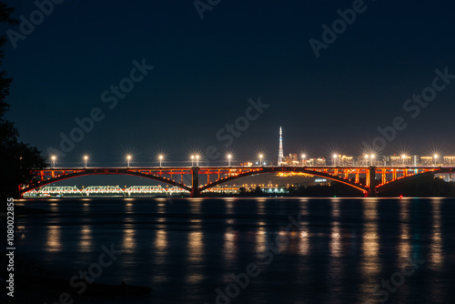 communal bridge over the Yenisei River in Krasnoyarsk at night